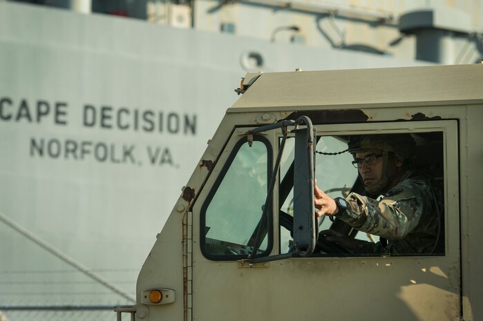 A U.S. Army Soldier prepares to drive a military vehicle onto Logistics Naval Vessel Cape Decision during Exercise Dragon Lifeline Aug. 7, 2019, at the Federal Law Enforcement Training Center in Charleston, S.C. The deployment readiness exercise combined the capabilities of service members from Fort Bragg, N.C., Joint Base Charleston, S.C., and Joint Base Langley-Eustis, Va., and focused on the rapid deployment of equipment, vehicles and personnel. Participants shared knowledge and tested their efficiency in moving assets by air, land, rail and sea during the training event. The annual exercise is just one of the critical readiness exercises the DOD conducts to maintain a lethal and ready force. (U.S. Air Force photo by Tech. Sgt. Christopher Hubenthal)