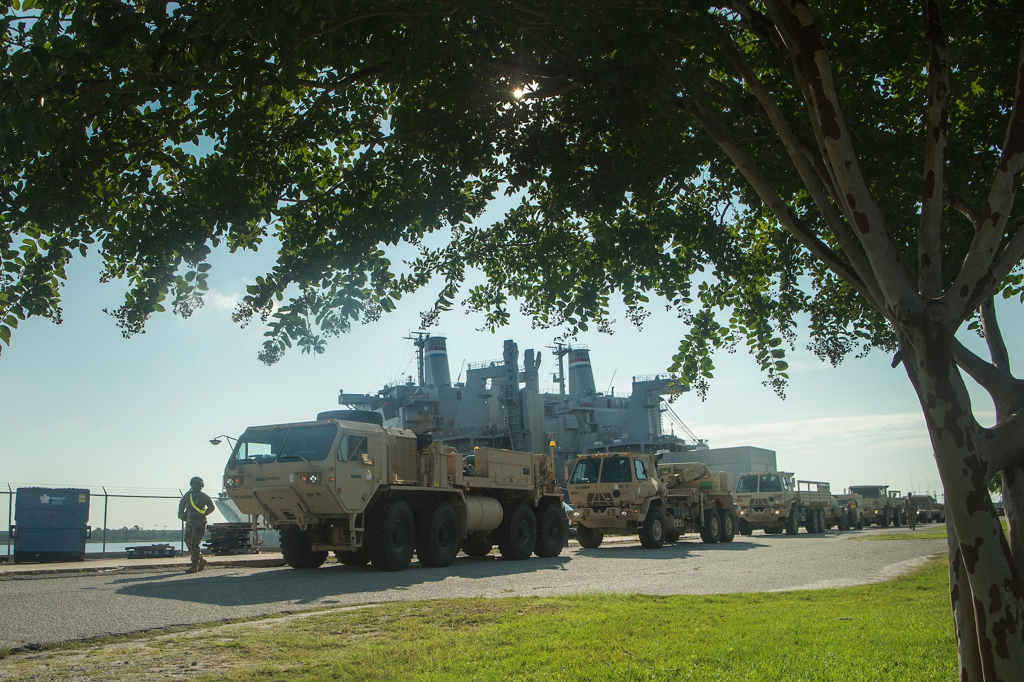 U.S. Army vehicles are staged prior to being moved onto the Logistics Naval Vessel Cape Decision during Exercise Dragon Lifeline Aug. 7, 2019, at the Federal Law Enforcement Training Center in Charleston, S.C. The exercise provided military personnel with experience needed to support rapid deployment operations across air, land, rail and sea. JB Charleston helps to provide rapid global deployment of personnel and equipment to deployed locations across the globe. The annual exercise is just one of the critical readiness exercises the DOD conducts to maintain a lethal and ready force. (U.S. Air Force photo by Tech. Sgt. Christopher Hubenthal)