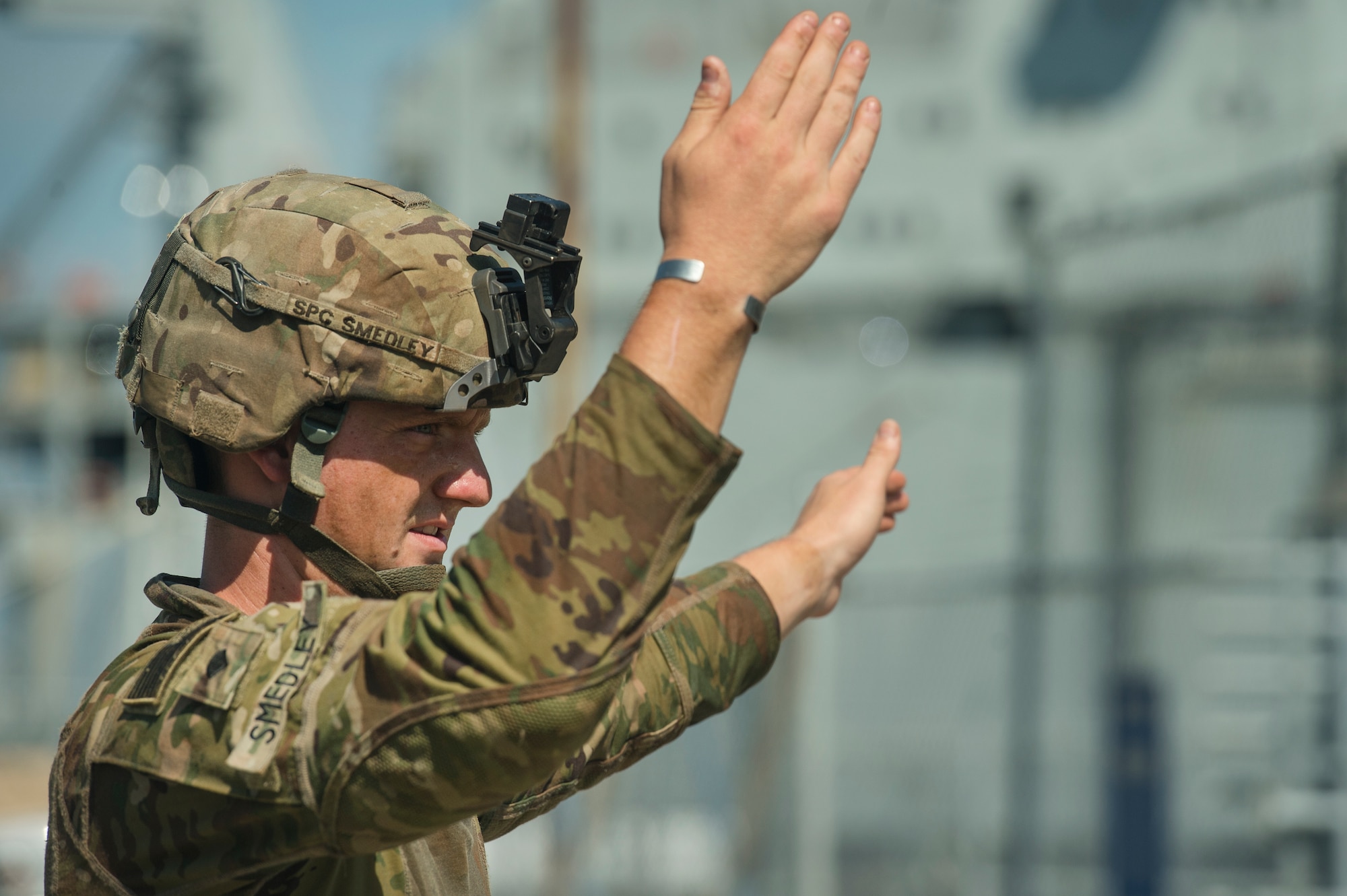 U.S. Army Spc. Robert Smedley, assigned to the 18th Field Artillery Brigade, 188th Brigade Support Battalion from Fort Bragg, N.C., directs military vehicles off Logistics Naval Vessel Cape Decision during Exercise Dragon Lifeline Aug. 7, 2019, at the Federal Law enforcement Training Center, S.C. The exercise provided military personnel with experience needed to support rapid deployment operations across air, land, rail and sea. JB Charleston helps to provide rapid global deployment of personnel and equipment is a capability that Joint Base Charleston helps to provide. The annual exercise is just one of the critical readiness exercises the DOD conducts to maintain a lethal and ready force. (U.S. Air Force photo by Tech. Sgt. Christopher Hubenthal)