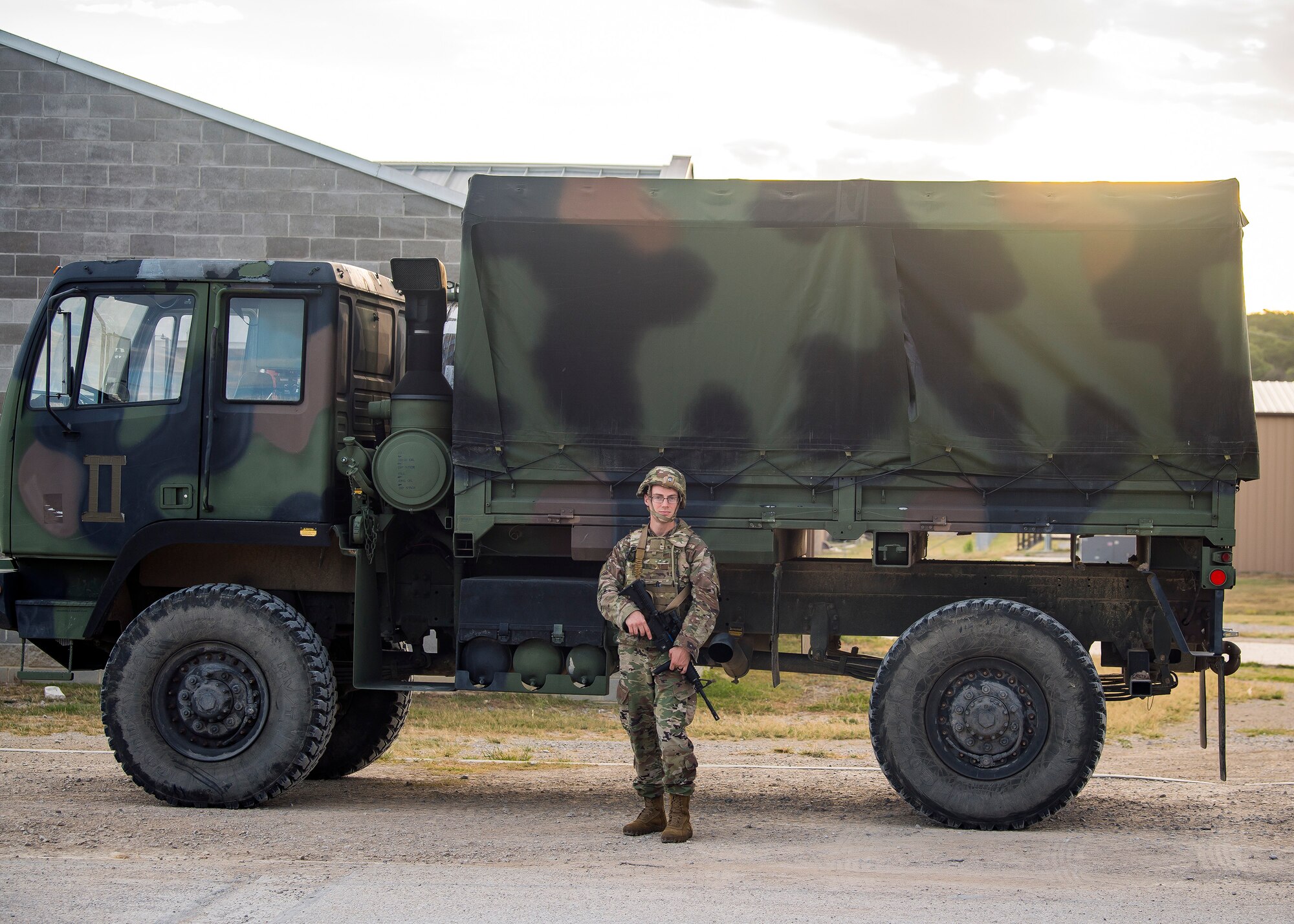 A Staff Weather Officer from the 3d Weather Squadron (WS), provides security for a Light Medium Tactical Vehicle during a certification field exercise (CFX), July 29, 2019, at Camp Bowie Training Center, Texas. The CFX was designed to evaluate the squadron’s overall tactical ability and readiness to provide the U.S. Army with full spectrum environmental support to the Joint Task Force (JTF) fight. While deployed, the Army relies on the 3d WS to provide them with current ground weather reports. These reports are then employed by commanders on the ground as they plan the best tactics and approaches to accomplish the mission. (U.S. Air Force photo by Airman 1st Class Eugene Oliver)