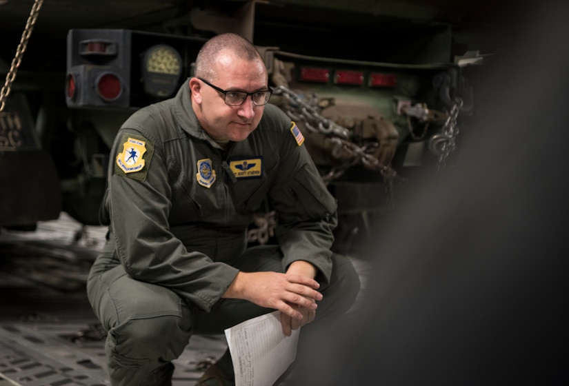 U.S. Air Force Tech Sgt. Scott Stueven, a load master assigned to the 437th Operations Group, inspects the aircraft cargo on a C-17 Globemaster III before departure as part of Exercise Dragon Lifeline August 8, 2019, at Joint Base Charleston, S.C. The deployment readiness exercise combined the capabilities of service members from Fort Bragg, N.C., Joint Base Charleston, S.C., and Joint Base Langley-Eustis, Va., focused on the rapid deployment of equipment, vehicles and personnel. Participants shared knowledge and tested their efficiency in moving assets by air, land, rail and sea during the training event. The annual exercise is just one of the critical readiness exercises the DOD conducts to maintain a lethal and ready force. (U.S. Air Force photo by Staff Sgt. Tenley Long)