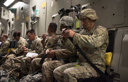 U.S. Army Soldiers strap into a C-17 Globemaster III, assigned to the 437th Airlift Wing, in preparation for aerial operations during Exercise Dragon Lifeline August 8, 2019, at Joint Base Charleston, S.C. The deployment readiness exercise combined the capabilities of service members from Fort Bragg, N.C., Joint Base Charleston, S.C., and Joint Base Langley-Eustis, Va., and focused on the rapid deployment of equipment, vehicles and personnel. Participants shared knowledge and tested their efficiency in moving assets by air, land, rail and sea during the training event. The annual exercise is just one of the critical readiness exercises the DOD conducts to maintain a lethal and ready force. (U.S. Air Force photo by Staff Sgt. Tenley Long)