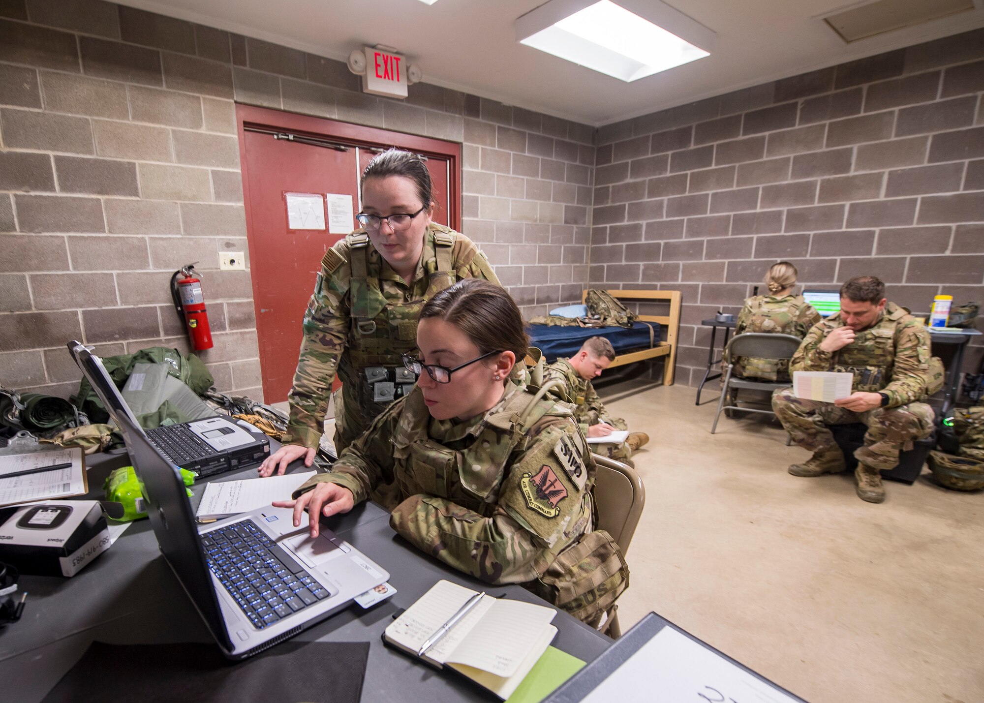 Staff Weather Officers from the 3d Weather Squadron (WS) input data into computers during a certification field exercise (CFX), July 29, 2019, at Camp Bowie Training Center, Texas. The CFX was designed to evaluate the squadron’s overall tactical ability and readiness to provide the U.S. Army with full spectrum environmental support to the Joint Task Force (JTF) fight. While deployed, the Army relies on the 3d WS to provide them with current ground weather reports. These reports are then employed by commanders on the ground as they plan the best tactics and approaches to accomplish the mission. (U.S. Air Force photo by Airman 1st Class Eugene Oliver)