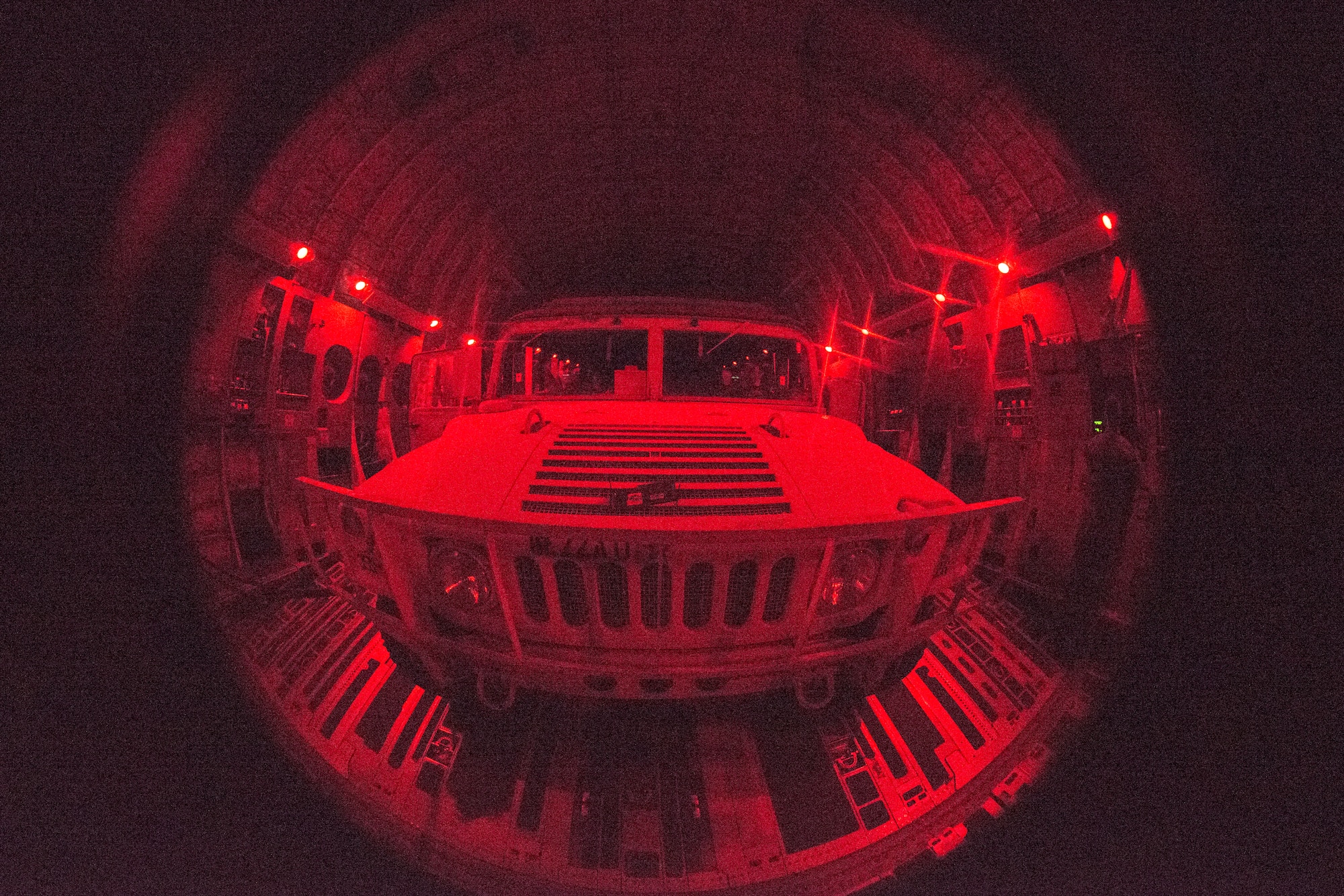 A U.S. Army Humvee sits on the cargo bay of a C-17 Globemaster III, assigned to the 437th Airlift Wing, as part of Exercise Dragon Lifeline August 8, 2019, above South Carolina. The deployment readiness exercise combined the capabilities of service members from Fort Bragg, N.C., Joint Base Charleston, S.C., and Joint Base Langley-Eustis, Va., focused on the rapid deployment of equipment, vehicles and personnel. Participants shared knowledge and tested their efficiency in moving assets by air, land, rail and sea during the training event. The annual exercise is just one of the critical readiness exercises the DOD conducts to maintain a lethal and ready force. (U.S. Air Force photo by Staff Sgt. Tenley Long)