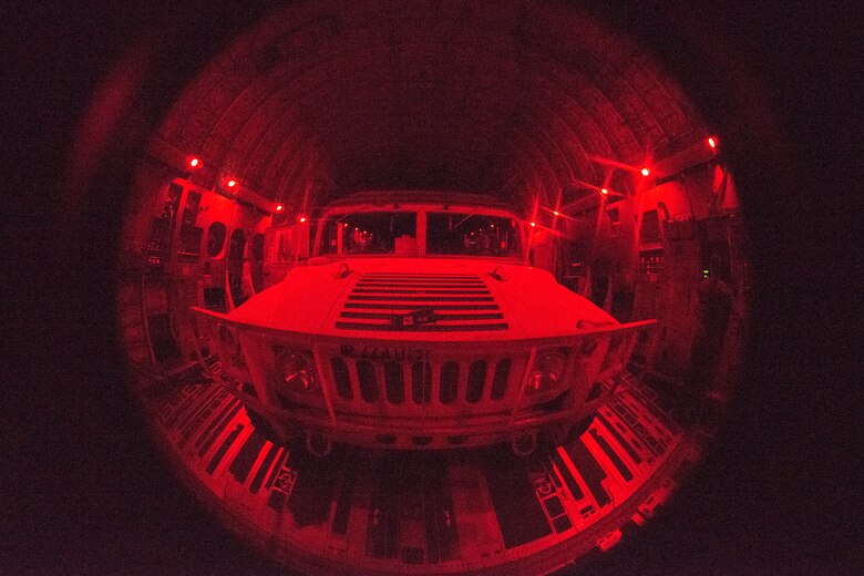 A U.S. Army Humvee sits on the cargo bay of a C-17 Globemaster III, assigned to the 437th Airlift Wing, as part of Exercise Dragon Lifeline August 8, 2019, above South Carolina. The deployment readiness exercise combined the capabilities of service members from Fort Bragg, N.C., Joint Base Charleston, S.C., and Joint Base Langley-Eustis, Va., focused on the rapid deployment of equipment, vehicles and personnel. Participants shared knowledge and tested their efficiency in moving assets by air, land, rail and sea during the training event. The annual exercise is just one of the critical readiness exercises the DOD conducts to maintain a lethal and ready force. (U.S. Air Force photo by Staff Sgt. Tenley Long)
