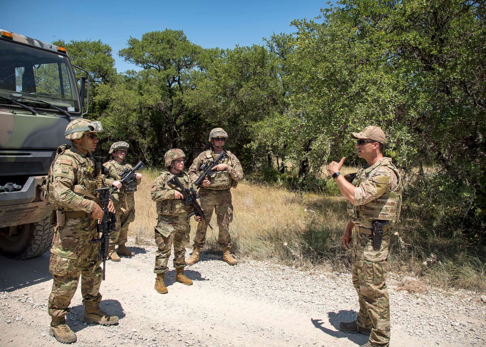 Master Sgt. Joshua Mccaslin, right, 3d Weather Squadron (WS) division Staff Weather Officer, briefs Airmen from the 3d Weather Squadron during a certification field exercise (CFX), July 29, 2019, at Camp Bowie Training Center, Texas. The CFX was designed to evaluate the squadron’s overall tactical ability and readiness to provide the U.S. Army with full spectrum environmental support to the Joint Task Force (JTF) fight. The CFX immersed Airmen into all the aspects of what could come with a deployment such as counter improvised explosive device awareness. (U.S. Air Force photo by Airman 1st Class Eugene Oliver)