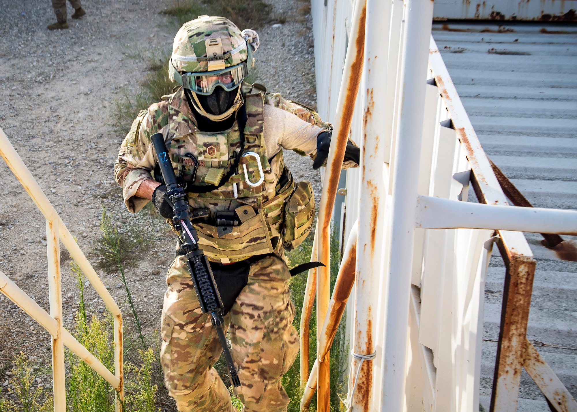 Master Sgt. James Kamphaus, 3d Weather Squadron mission support flight chief, climbs a flight of stairs during a certification field exercise (CFX), July 29, 2019, at Camp Bowie Training Center, Texas. The CFX was designed to evaluate the squadron’s overall tactical ability and readiness to provide the U.S. Army with full spectrum environmental support to the Joint Task Force (JTF) fight. The CFX immersed Airmen into all the aspects of what could come with a deployment such as force on force scenarios. (U.S. Air Force photo by Airman 1st Class Eugene Oliver)