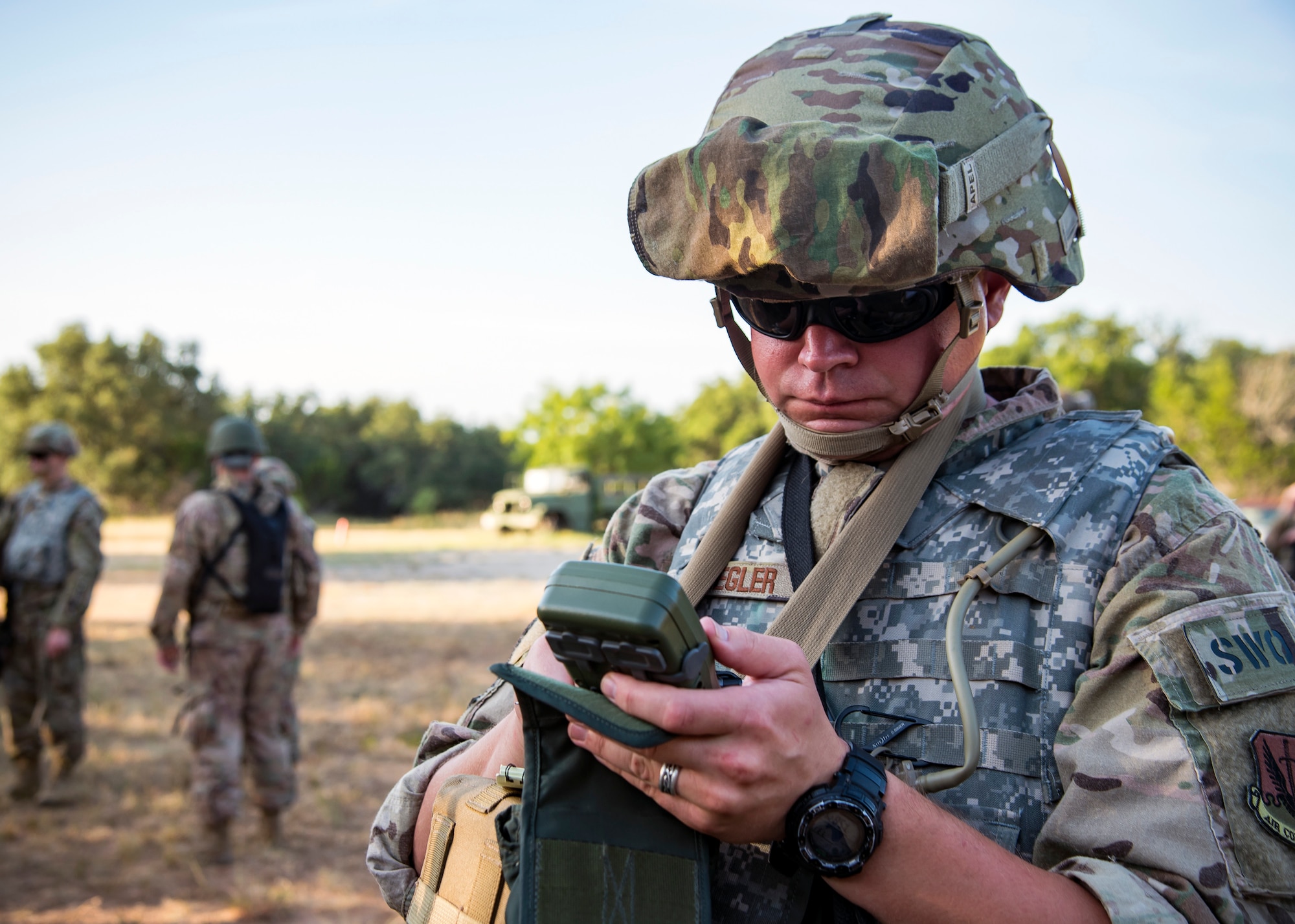 Master Sgt. Ryan Kegler, 3d Weather Squadron Det 1 section chief of division weather operations, reads a defense advanced GPS receiver during a certification field exercise (CFX), July 31, 2019, at Camp Bowie Training Center, Texas. The CFX was designed to evaluate the squadron’s overall tactical ability and readiness to provide the U.S. Army with full spectrum environmental support to the Joint Task Force (JTF) fight. The CFX immersed Airmen into all the aspects of what could come with a deployment such as Land Navigation. (U.S. Air Force photo by Airman 1st Class Eugene Oliver)