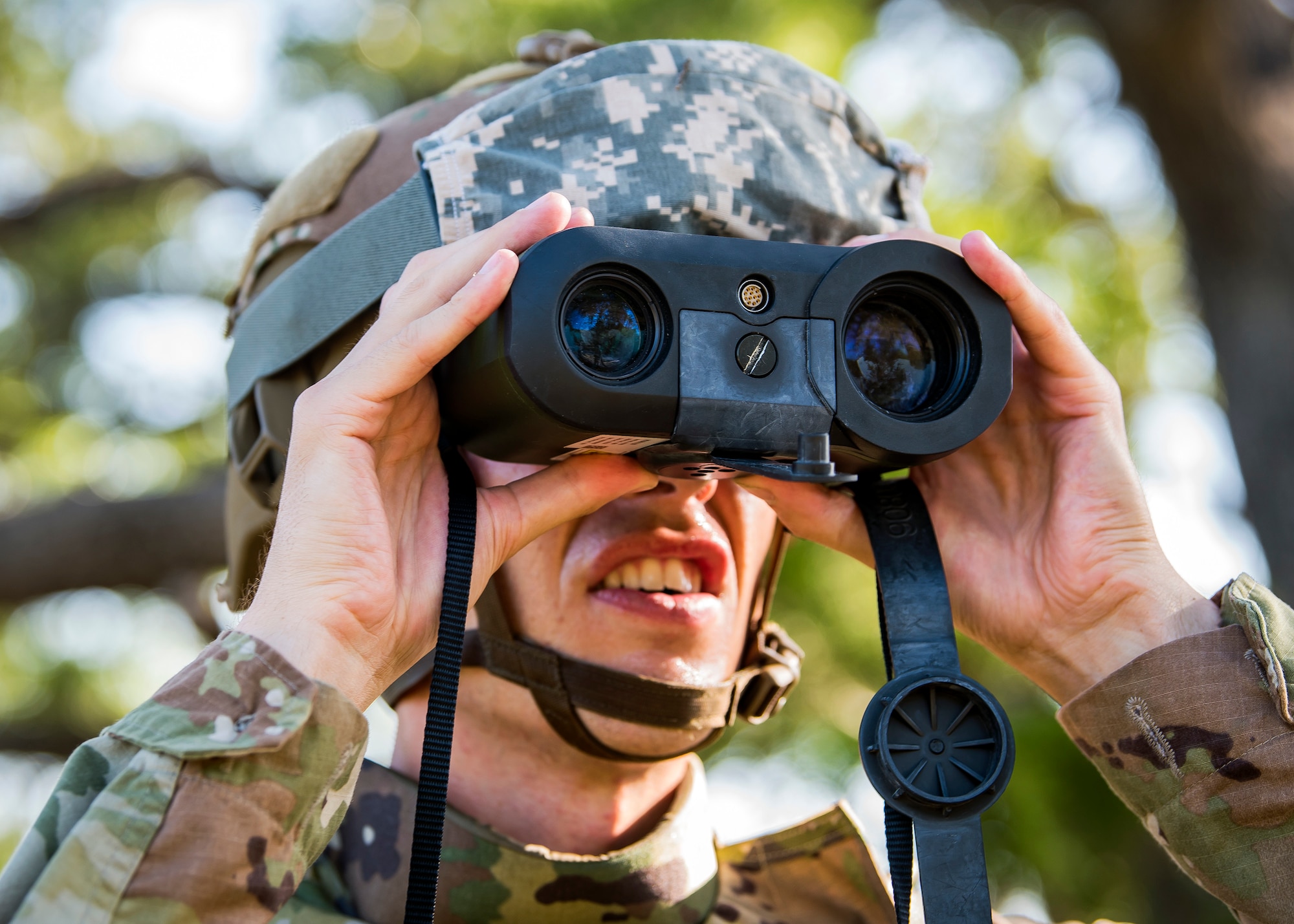 Airman 1st Class Mark Dunlop, 3d Weather Squadron weather forecaster, utilizes a laser range finder to locate a check point during a certification field exercise (CFX), July 31, 2019, at Camp Bowie Training Center, Texas. The CFX was designed to evaluate the squadron’s overall tactical ability and readiness to provide the U.S. Army with full spectrum environmental support to the Joint Task Force (JTF) fight. The CFX immersed Airmen into all the aspects of what could come with a deployment such as Land Navigation. (U.S. Air Force photo by Airman 1st Class Eugene Oliver)