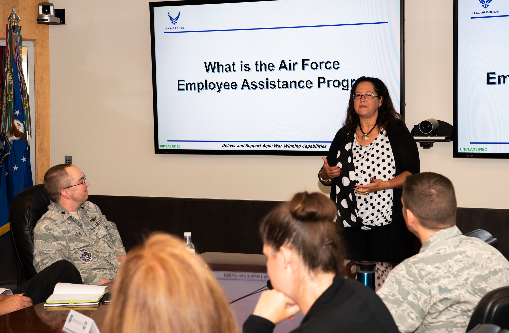 Danna Plewe, Air Force Employee Assistance Program Manager, briefs personnel on the benefits of the EAP, at Schriever Air Force Base, Colorado, Aug. 7, 2019. The EAP is a professional service which provides problem solving, coaching, information, consultation, counseling, resource identification and support to all civilian and non-appropriated fund employees. (U.S. Air Force photo by Staff Sgt. Matthew Coleman-Foster)