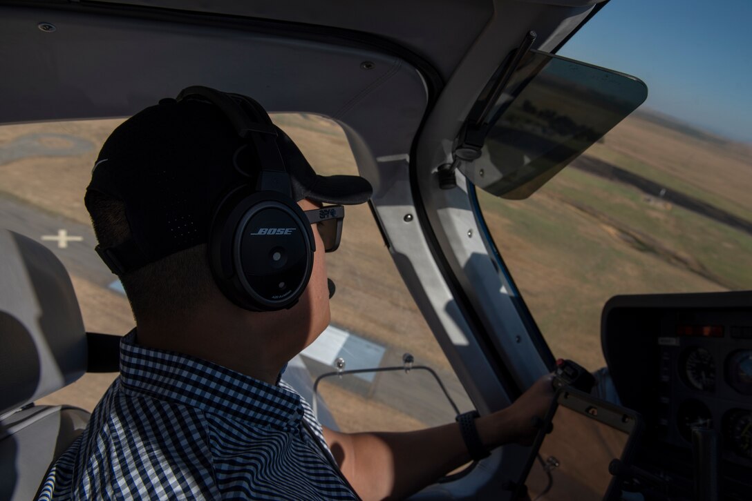 U.S. Air Force Tech. Sgt. Ron, 860th Aircraft Maintenance Squadron flight line expediter, mans the controls of a Socata Trinidad TB-20 July 27, 2019, during a flight over the San Francisco Bay Area. Ron has accumulated more than 250 flying hours and completed Air Force remote pilot aircraft training July 12. (U.S. Air Force photo by Tech. Sgt. James Hodgman)