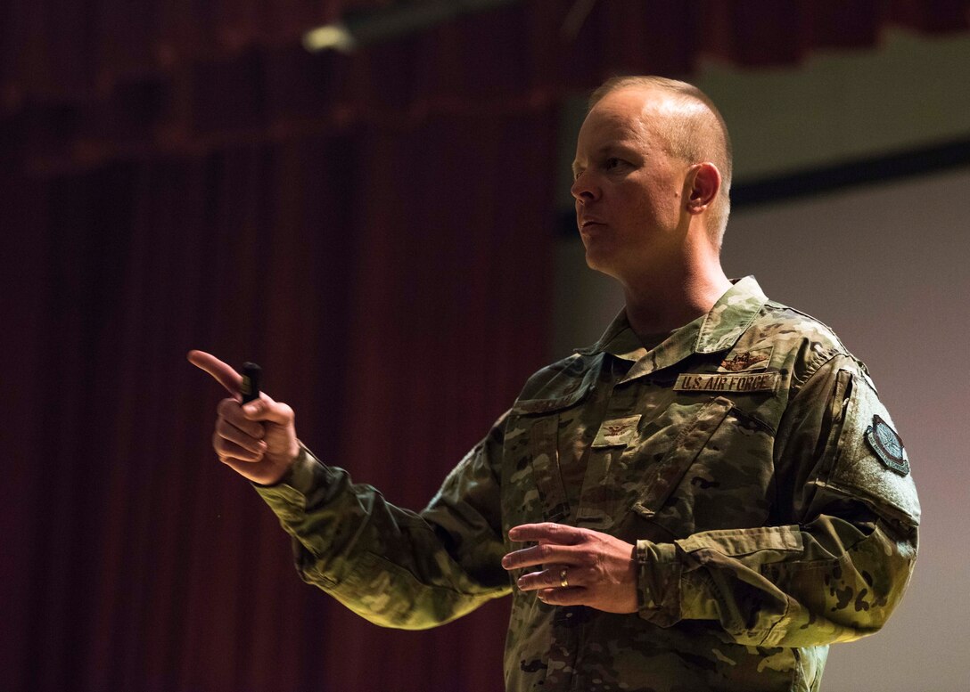 U.S. Air Force Col. Derek Salmi, 92nd Air Refueling Wing commander, addresses Airmen during a base-wide all call addressing suicide awareness at Fairchild Air Force Base, Washington, Aug. 7, 2019. The all calls kicked-off a wing-wide effort to take a Resilience Tactical Pause to address issues that have led to Air Force member suicides. (U.S. Air Force photo by Airman 1st Class Lawrence Sena)