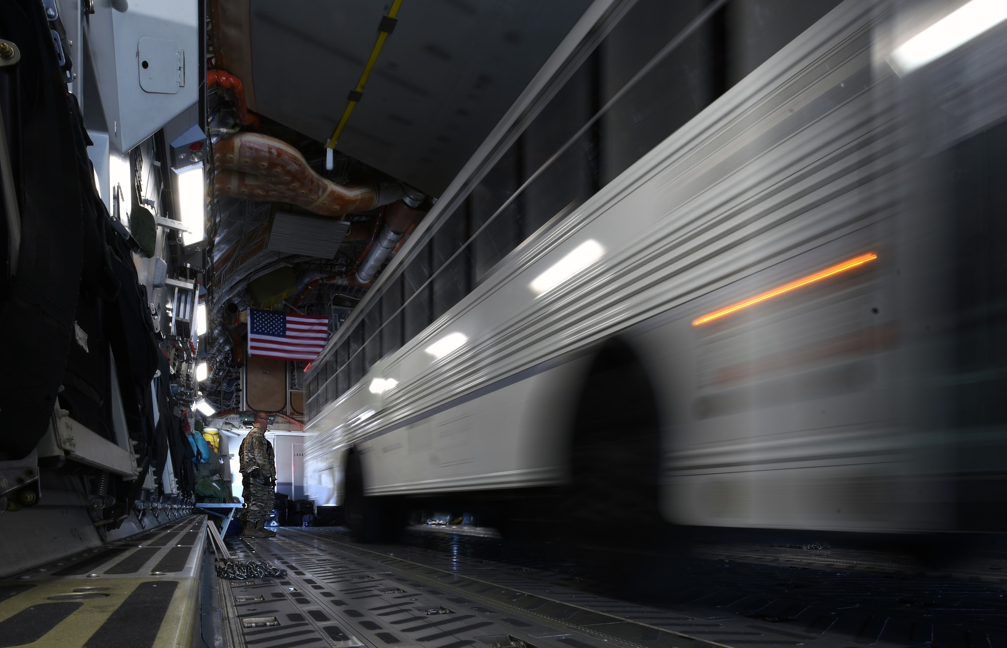 A simulated ambulance is loaded onto a C-17 Globemaster III aircraft Aug. 1, 2019, at Travis Air Force Base, California. The load-up was part of a joint force mobility exercise involving Airmen from Travis AFB and March Air Reserve Base, California. (U.S. Air Force photo by Senior Airman Christian Conrad)