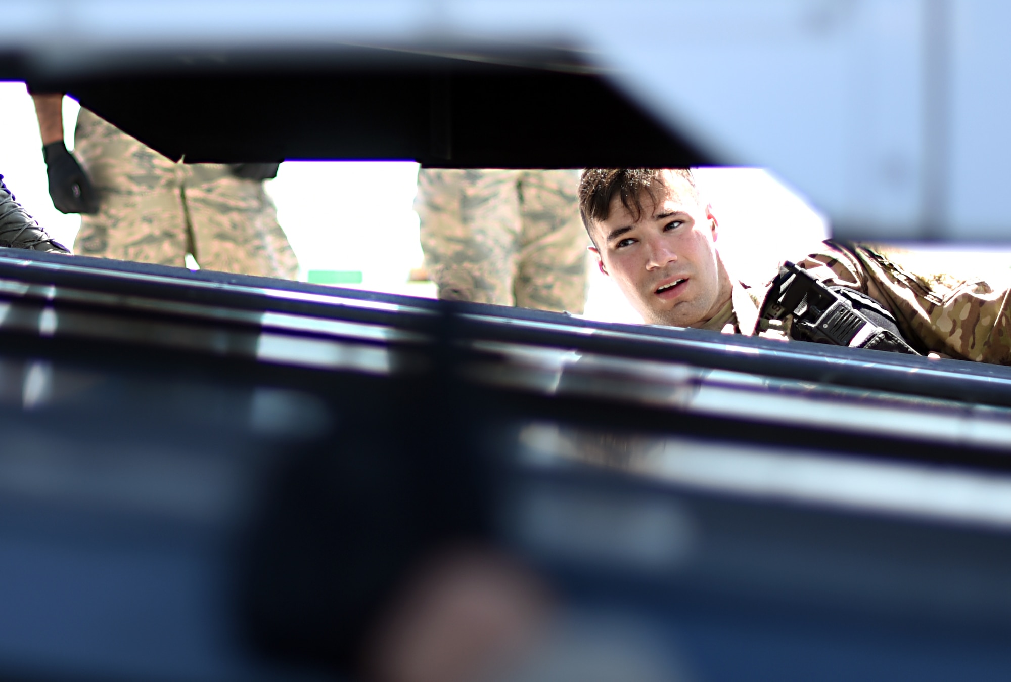 U.S. Air Force Airman 1st Class Anthony Sauma, 60th Aerial Port Squadron air transportation journeyman, ensures the proper load-up of a simulated ambulance onto a C-17 Globemaster III aircraft Aug. 1, 2019, at Travis Air Force Base, California. The exercise utilized the expertise of both 60th APS and 729th APS Airmen to augment Travis mobility operations. (U.S. Air Force photo by Senior Airman Christian Conrad)