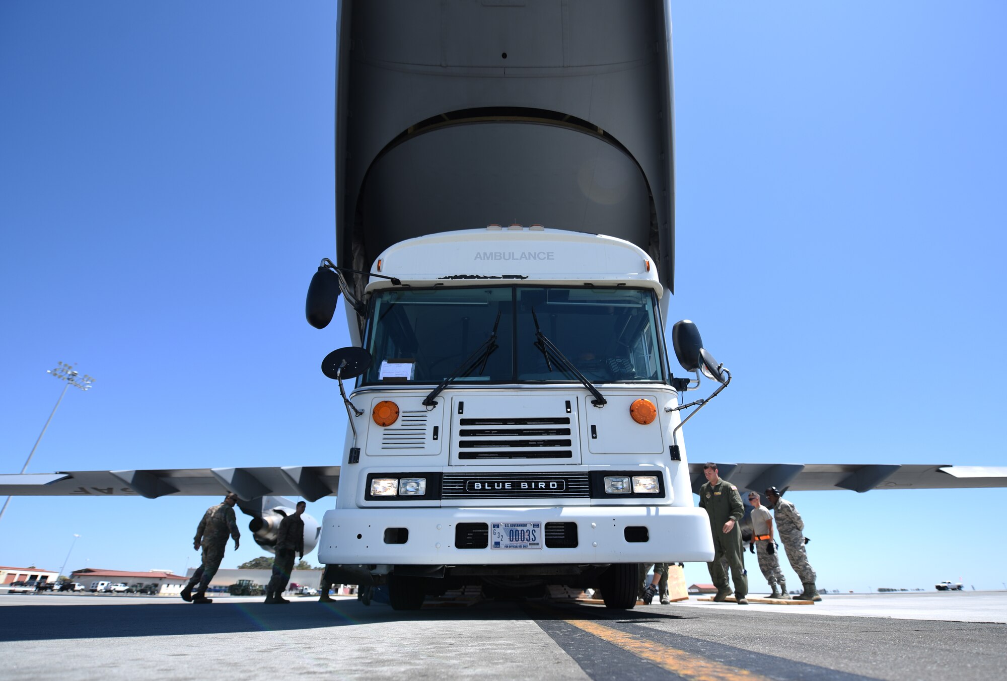 A simulated ambulance is loaded onto a C-17 Globemaster III aircraft Aug. 1, 2019, at Travis Air Force Base, California. The load-up was part of a joint force mobility exercise involving Airmen from Travis AFB and March Air Reserve Base, California. (U.S. Air Force photo by Senior Airman Christian Conrad)