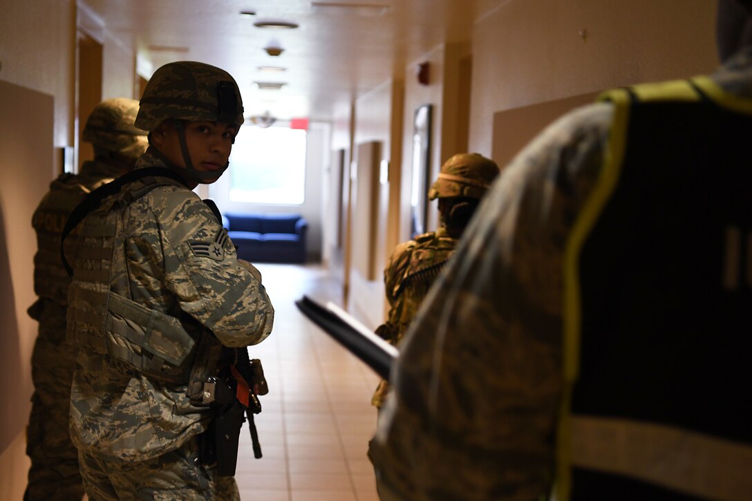 Airmen assigned to the 30th Security Forces Squadron sweep a building during an active shooter exercise Aug. 7, 2019, at Vandenberg Air Force Base, Calif.