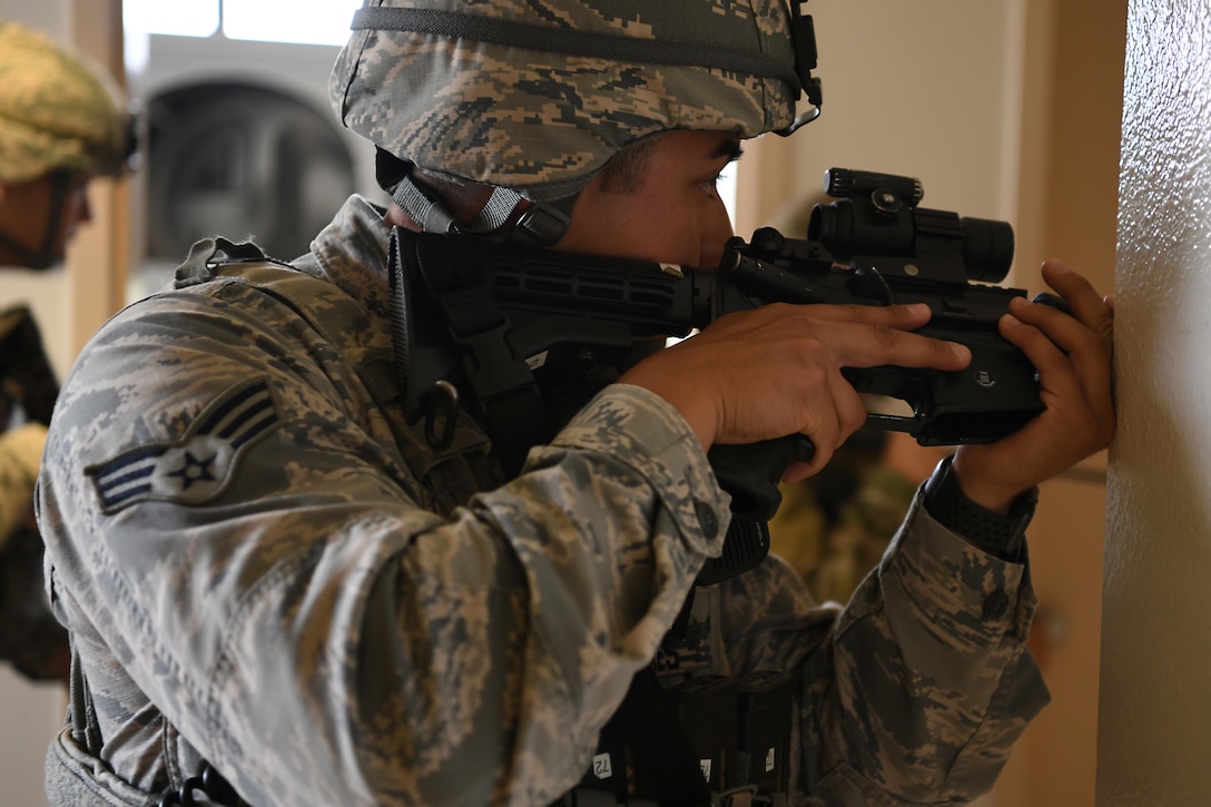 Senior Airman Pedro Cazares, 30th Security Forces Squadron patrolman, sweeps a building during an active shooter exercise Aug. 7, 2019, at Vandenberg Air Force Base, Calif.