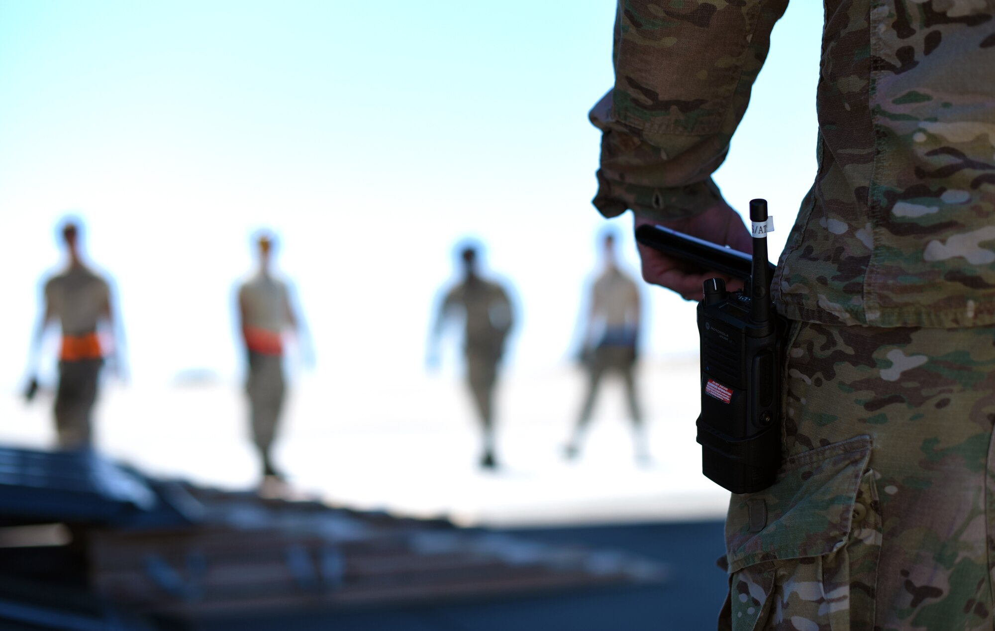 U.S. Air Force Tech. Sgt. Phillip Murant, 60th Aerial Port Squadron evaluator, awaits the load-up of a simulated ambulance onto a C-17 Globemaster III aircraft Aug. 1, 2019, at Travis Air Force Base, California. Murant’s job as evaluator was to verify the proper load of the ambulance onto the aircraft per Air Force guidelines, ensuring both the safety and competence of the loadmasters involved during the exercise. (U.S. Air Force photo by Senior Airman Christian Conrad)