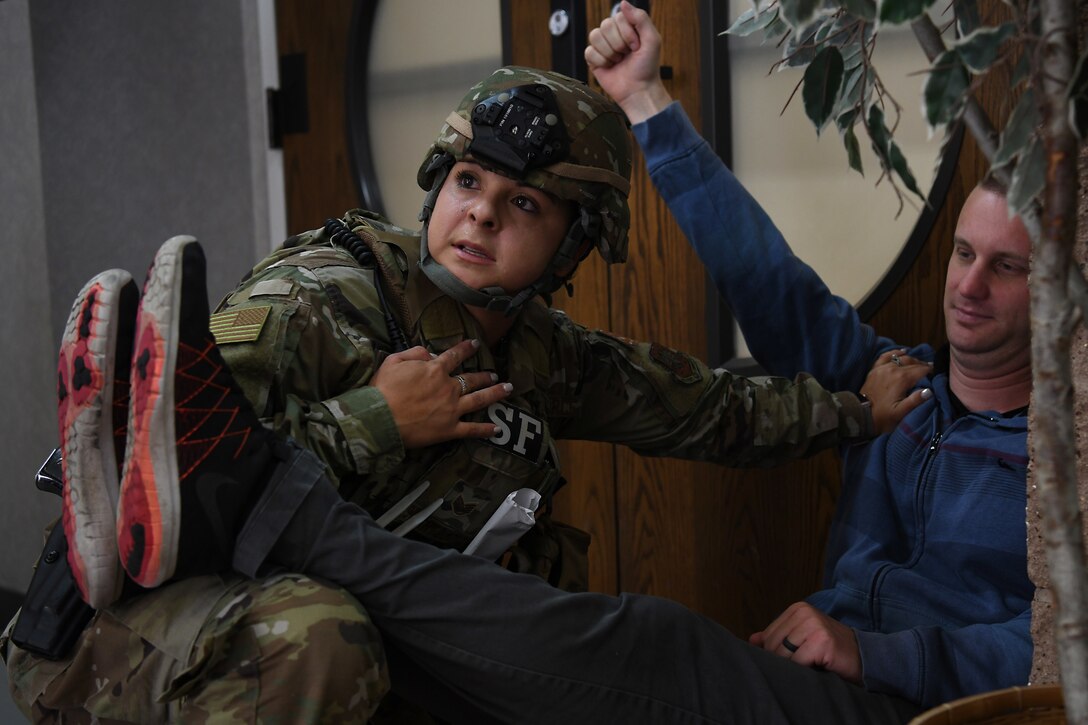 Staff Sgt. Cinthia Swartzlander, 30th Security Forces Squadron patrolman, provides emergency aid to a simulated victim during an active shooter exercise Aug. 7, 2019, at Vandenberg Air Force Base, Calif.