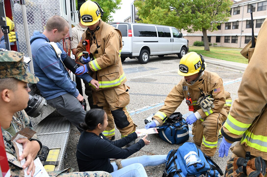 Staff Sgt. Cinthia Swartzlander, 30th Civil Engineering Squadron, assists a simulated victim during an active shooter exercise Aug. 7, 2019, at Vandenberg Air Force Base, Calif.