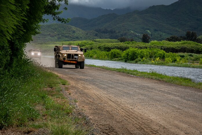 U.S. Marines with 3d Marine Regiment drive a Joint Light Tactical Vehicle (JLTV) during a JLTV field training exercise, Marine Corps Training Area Bellows, July 29, 2019. The JLTV Family of Vehicles is a U.S. Army-led, joint acquisition program with the U.S. Marine Corps, is intended to close an existing, critical capability gap in the services' light tactical wheeled vehicle fleets. The Marine Corps’ Joint Light Tactical Vehicles has achieved initial operational capability. (U.S. Marine Corps photo by Cpl. Matthew Kirk)