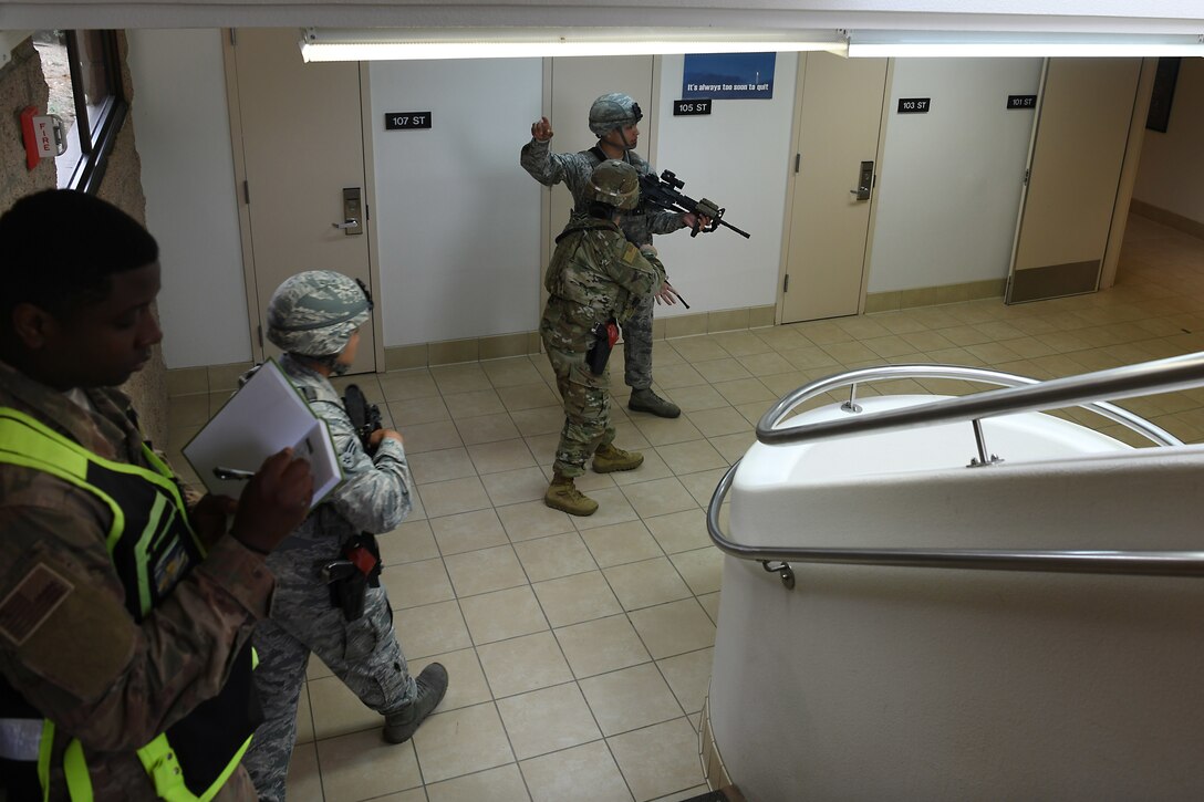 Airmen assigned to the 30th Security Forces Squadron sweep a building during an active shooter exercise Aug. 7, 2019, at Vandenberg Air Force Base, Calif.