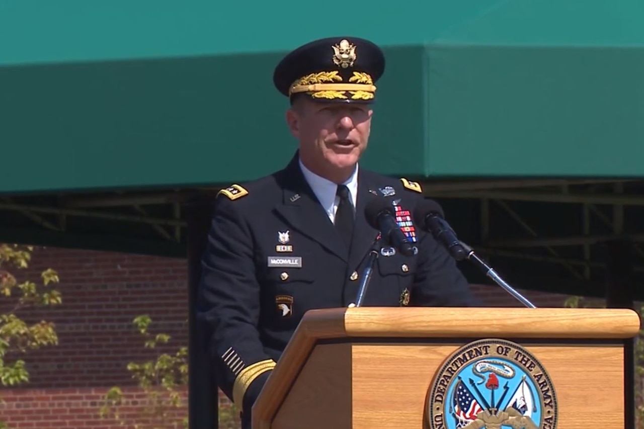 A man speaks at a podium.