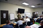 Airmen from the 8th Fighter Wing participate in a role-playing exercise mimicking a clinic customer service process during a Continuous Process Improvement class at Kunsan Air Base, Republic of Korea, July 11, 2019. The participants dealt with redundant processes, before learning to write a problem statement and find innovative solutions.