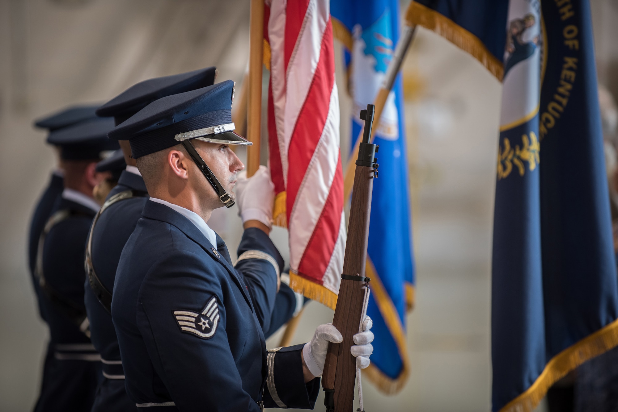 The 123rd Airlift Wing Honor Guard presents the colors during a ceremony to bestow the Distinguished Flying Cross at the Kentucky Air National Guard Base in Louisville, Ky., Aug. 10, 2019. The award recipient, Lt. Col. John " J.T." Hourigan, earned the medal for decisive action following a catastrophic mechanical failure while flying a C-130 aircraft during a routine training sortie, saving the lives of six crew members and a $30 million aircraft. (U.S. Air National Guard photo by Lt. Col. Dale Greer)
