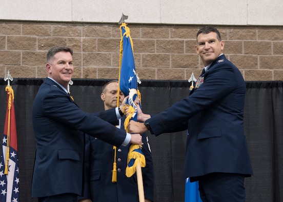Col. Leon J. Dodroe assumes command of the 188th Wing from Brig. Gen. Thomas D. Crimmins, Arkansas National Guard air component commander, during a change of command ceremony at Fort Smith, Ark., Aug. 11, 2019. The change of command is a military tradition signified with the passing of the unit's guidon flag from one commander to the next. (U.S. Air National Guard photo by Tech. Sgt. John E. Hillier)
