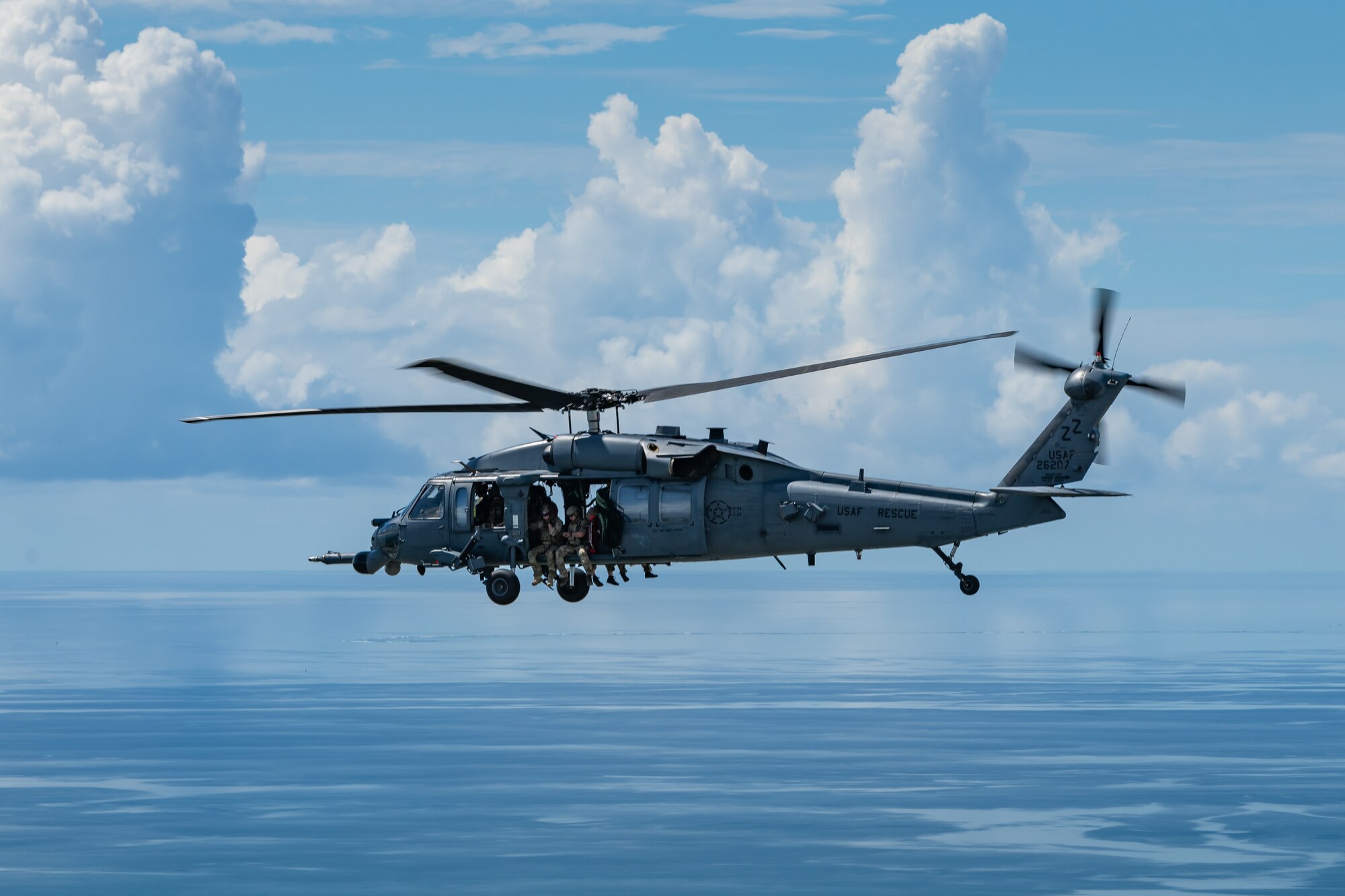 An HH-60G Pave Hawk from the 33rd Rescue Squadron flies during a training exercise, July 26, 2019, out of Kadena Air Base, Japan. The 33rd RQS has performed search, rescue, and recovery missions since 1952. (U.S. Air Force photo by Airman 1st Class Matthew Seefeldt)
