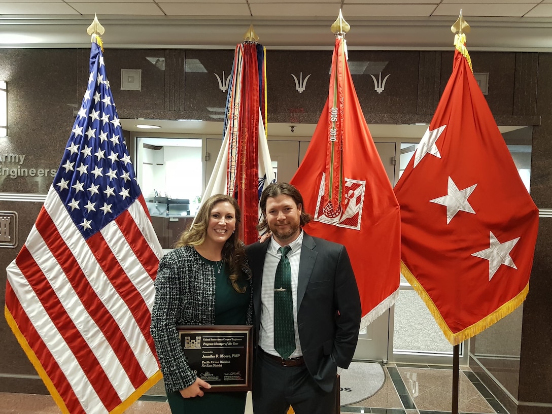 Jennifer Moore, U.S. Army Corps of Engineers (USACE), Far East District (FED), Air Force Program Branch Chief, stands with her husband Ross Moore, Security Operations Branch, physical security specialist, after being awarded the USACE Program Manager of the Year award, Washington, D.C., Aug. 2.