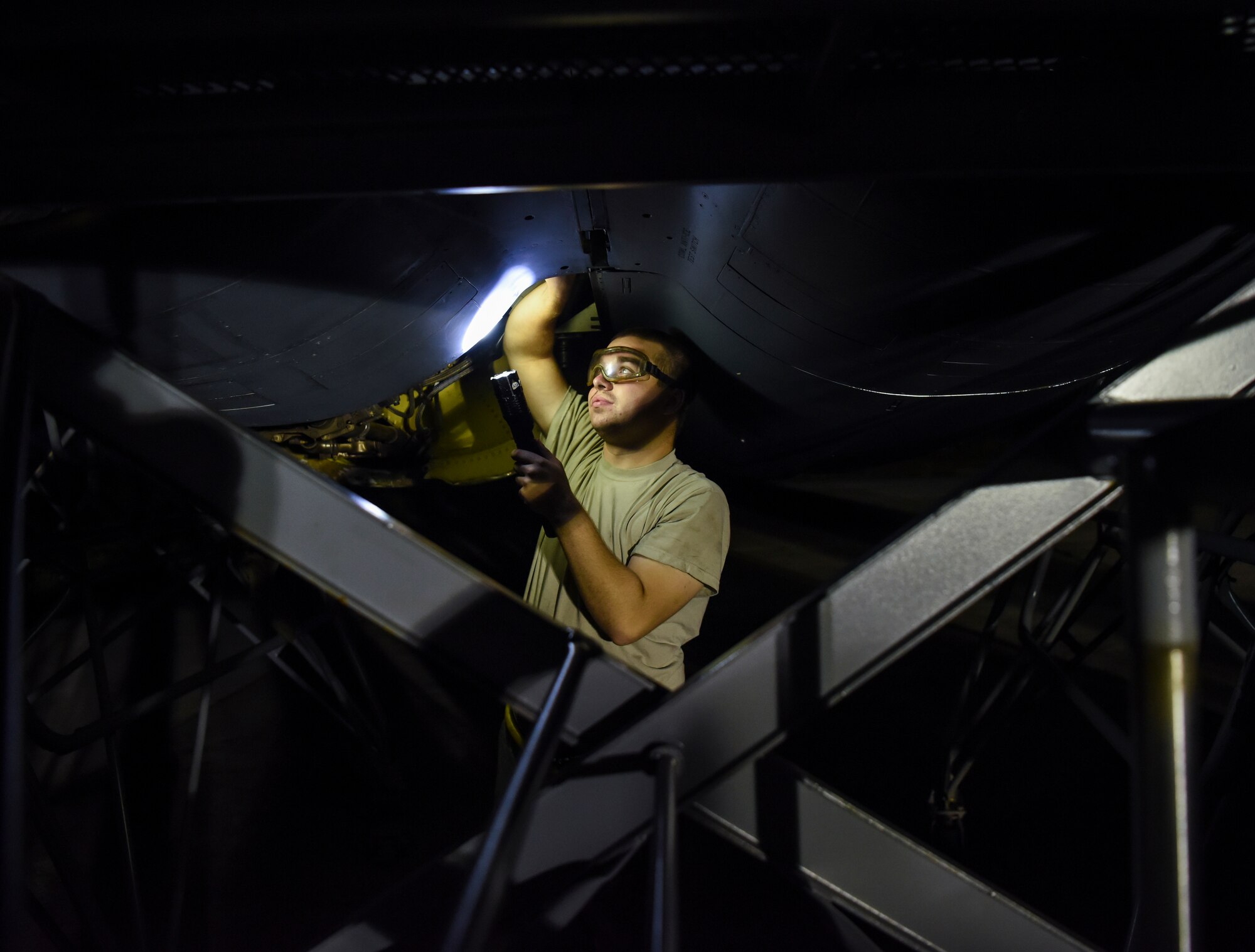 Airman 1st Class Thomas Train, 69th Aircraft Maintenance Squadron crew chief, installs a ring cowl on a 69th Expeditionary Bomb Squadron B-52 Stratofortress on Andersen Air Force Base, Guam, Aug. 7, 2019.