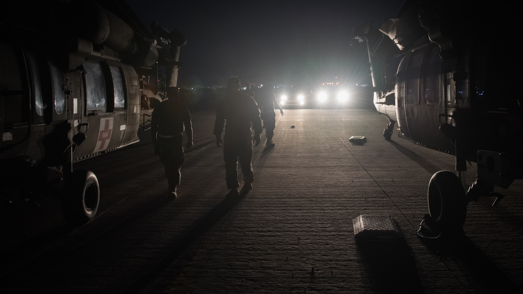 U.S. Airmen and Soldiers prepare to perform a joint inspection on two U.S. Army UH-60 Black Hawk helicopters at Ali al Salem Air Base, Kuwait, Aug. 9, 2019. Service members assigned to the 386th Expeditionary Logistics Readiness Squadron and the 8-229th Assault Helicopter Battalion inspect the Black Hawks to ensure they're airworthy to load onto U.S. Air Force C-17 Globemaster III aircraft. The Black Hawks will then undergo transport to a location within the U.S. Central Command area of responsibility. Inspectors perform a number of functions including measuring and weighing the helicopter, thoroughly assessing the aircraft and unloading its cargo to ensure it meets the safety requirements for transport. (U.S. Air Force photo by Tech. Sgt. Daniel Martinez)