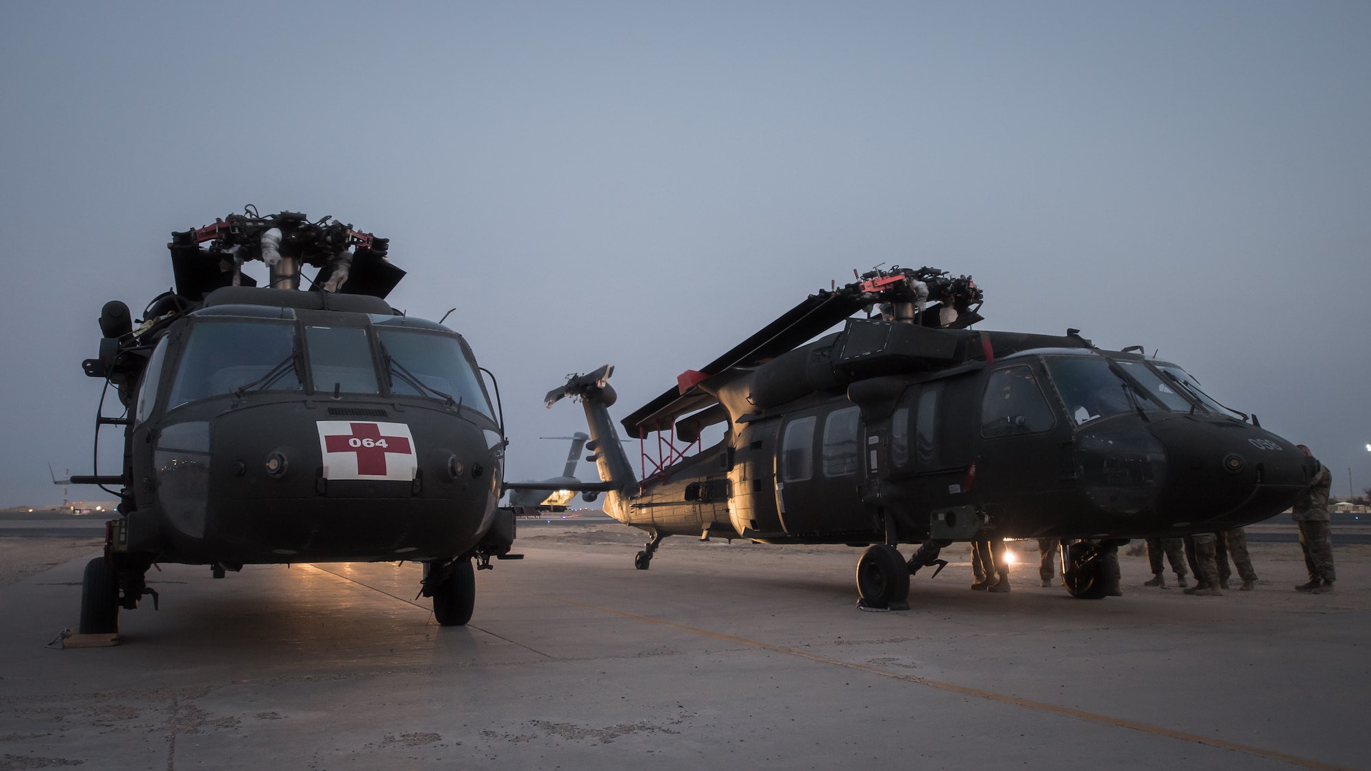 U.S. Airmen and Soldiers perform a joint inspection on two U.S. Army UH-60 Black Hawk helicopters at Ali al Salem Air Base, Kuwait, Aug. 9, 2019. Service members assigned to the 386th Expeditionary Logistics Readiness Squadron and the 8-229th Assault Helicopter Battalion inspect the Black Hawks to ensure they're airworthy to load onto U.S. Air Force owned C-17 Globemaster III aircraft. The Black Hawks will then undergo transport to a location within the U.S. Central Command area of responsibility. (U.S. Air Force photo by Tech. Sgt. Daniel Martinez)