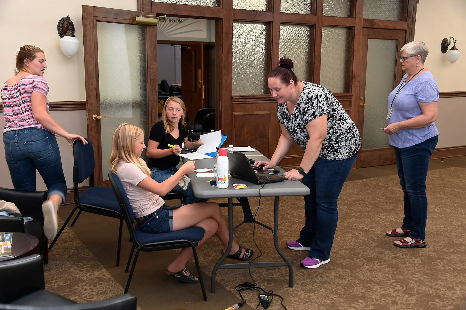 Volunteers check-in donors for their appointments at the Aug. 7 blood drive at the Hart-Dole-Inouye Federal Center.