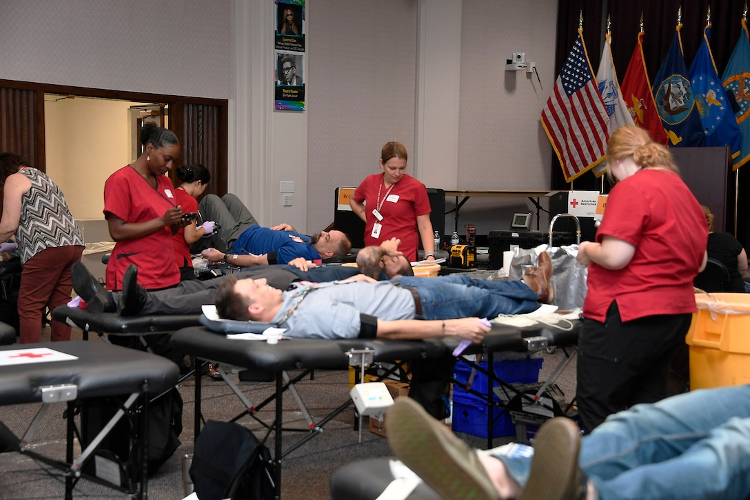 Red Cross workers assist donors at the Aug. 7 blood drive at the Hart-Dole-Inouye Federal Center.