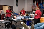 Red Cross workers assist donors at the Aug. 7 blood drive at the Hart-Dole-Inouye Federal Center.