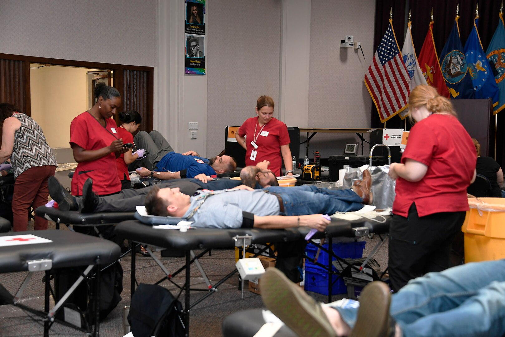 Red Cross workers assist donors at the Aug. 7 blood drive at the Hart-Dole-Inouye Federal Center.