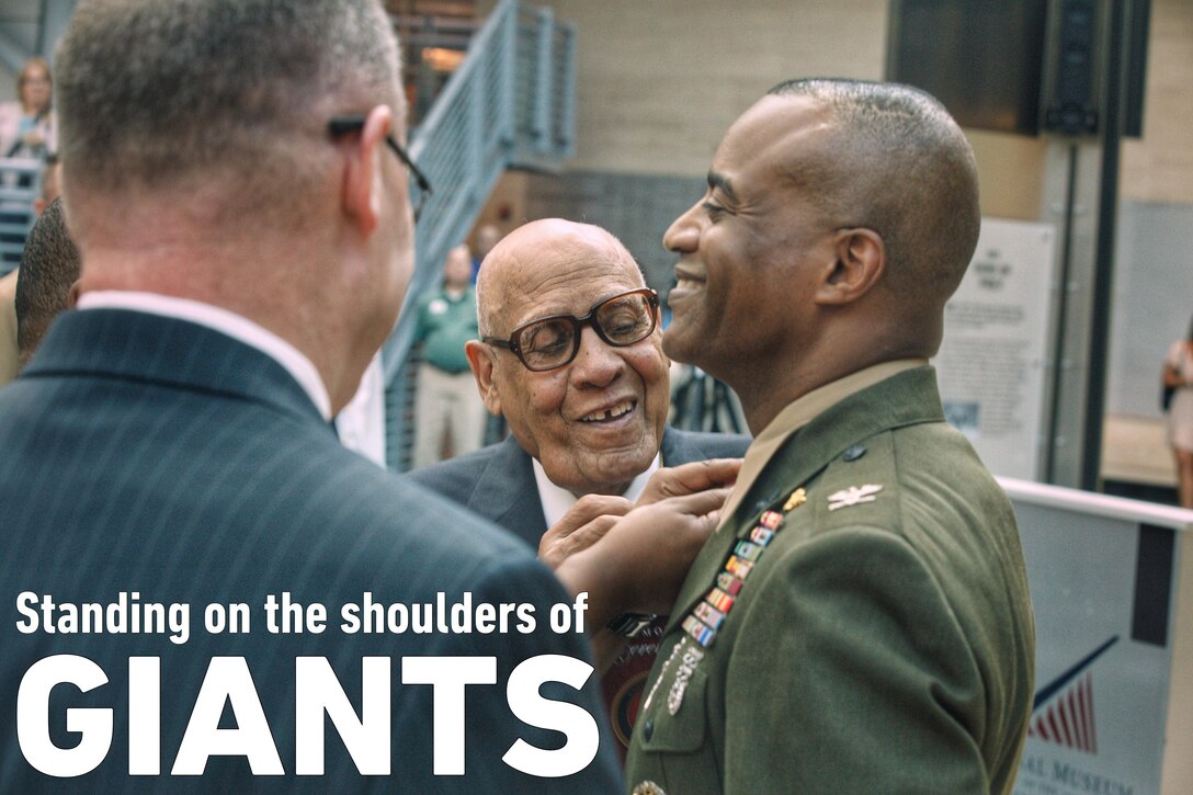 Master Gunnery Sgt. Carroll W. Braxton (Ret.) pins the rank of brigadier general to Melvin G. Carter's collar during a ceremony at the National Museum of the Marine Corps in Triangle, Virginia, August 9, 2019. Carter grew up in York, Pennsylvania and enlisted in the Marine Corps in 1985. He was awarded a NROTC Scholarship to attend Morehouse College in Atlanta, Georgia and was commissioned as a second lieutenant in the United States Marine Corps upon graduating in 1992. During most of his 34 years of service, Carter has served as a Marine Air Ground Task Force Intelligence Officer and has completed multiple tours overseas in combat zones to include Operation Joint Endeavor in Bosnia and Herzegovina, Operation Anaconda in Afghanistan, Operations Balkan Justice and Restore Freedom, and Operation Iraqi Freedom. He will now serve as the Director of Intelligence, Headquarters Marine Corps. 

Braxton was one of the 20,000 African American Marines who from 1942-1949 received basic training at a segregated facility, Camp Montford Point, in Jacksonville, North Carolina. Braxton served in the Pacific Theater during World War II, seeing action in the battles of Saipan, Peleliu, Iwo Jima, and Okinawa. He was called back to duty in 1950 during the Korean War where he served as a combat instructor. He retired from the Marine Corps in 1980.

(U.S. Marine Corps photo by Staff Sgt. Bryan Nygaard)