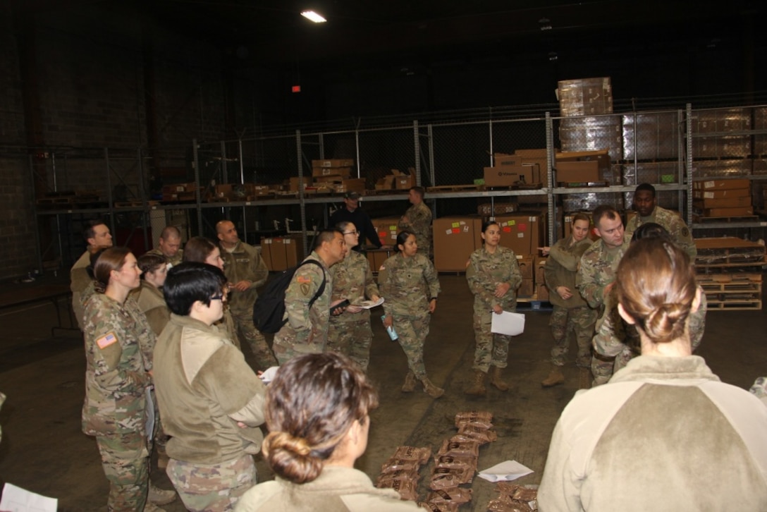 Meals, Ready-to-Eat ordered through the DLA Troop Support Subsistence Total Order and Receipt Electronic System are inspected at a warehouse Dec. 6, 2018, at Fort Lewis, Washington. The Subsistence cataloging team partnered with DLA Information Operations team to improve the customer item request and cataloging process in the STORES system. (U.S. Army photo by Emily Yeh)