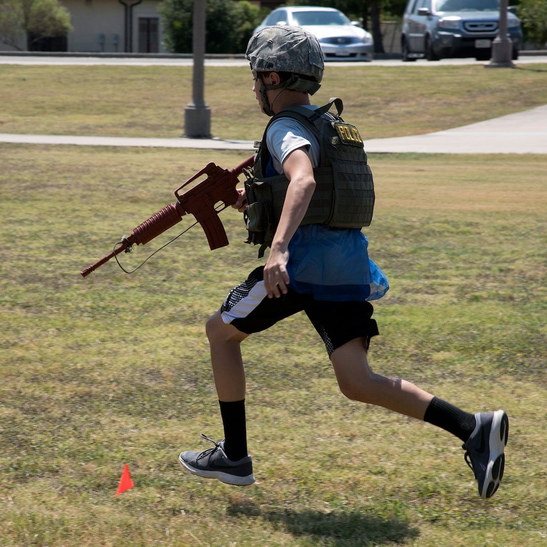 A participant runs during the Junior Battle of the Badges staged by the 902nd Security Forces Squadron at Heritage Park on Joint Base San Antonio-Randolph Aug. 2. (U.S. Air Force photo by Brian Lepley)