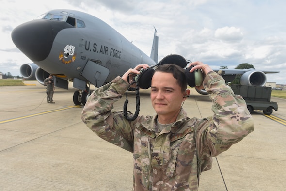 U.S. Air Force Senior Airman Joseph Finigan, 100th Aircraft Maintenance Squadron aircraft hydraulics systems journeyman, puts on a second layer of hearing protection over his dual in-ear headset at RAF Mildenhall, England, Aug. 6, 2019. The headset enables communication by transmitting sound waves through the bones in the user’s ear.  (U.S. Air Force photo by Airman 1st Class Joseph Barron)