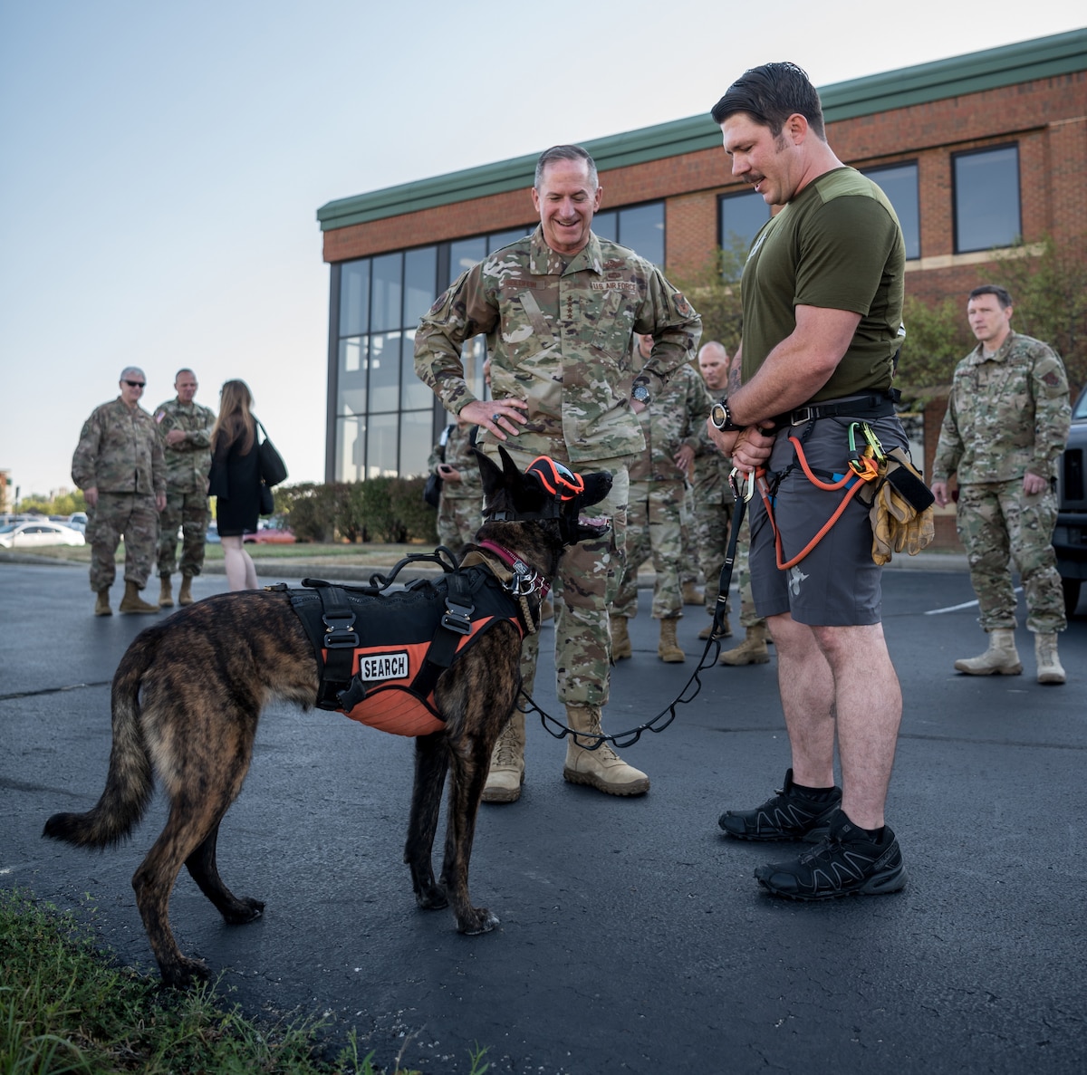 Air Force Chief of Staff Gen. David L. Goldfein (left) meets Callie, the only search-and-rescue dog in the Department of Defense, and her handler, Master Sgt. Rudy Parsons, a pararescueman in the 123rd Special Tactics Squadron, during a tour of the Kentucky Air National Guard Base in Louisville, Ky., Aug. 10, 2019. Goldfein toured various work centers, learning about the unique mission sets of the 123rd Airlift Wing. (U.S. Air National Guard photo by Staff Sgt. Joshua Horton)
