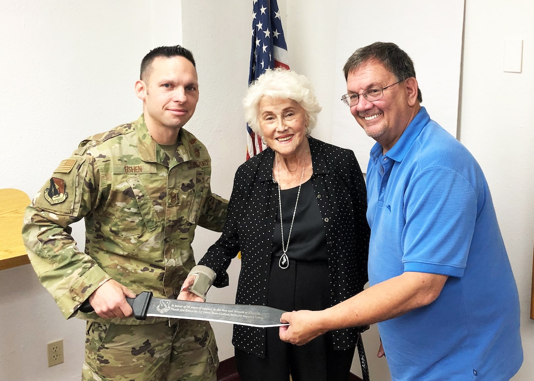 Command Chief Master Sgt. Ian EISHEN, 412th Test Wing Command Chief Master Sergeant, presented Edwards Air Force Base Civilian-Military Support Group President Al Hoffman and Civ-Mil Founder, Aida O’Connor with a commemorative sword in recognition of Civ-Mil’s 30 years of continuous support to Edwards AFB. (U.S. Air Force photo by Danny Bazzell)