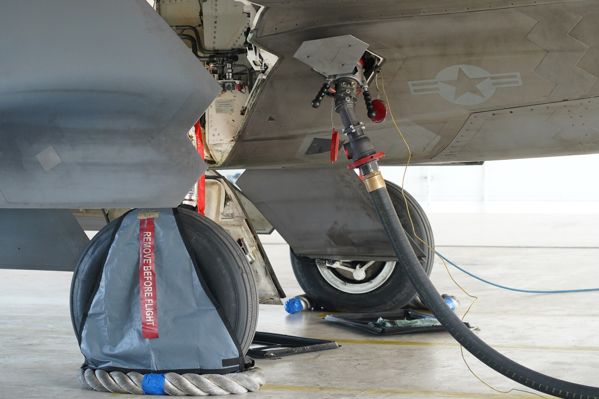 An F-22 Raptor is refueled by Airmen assigned to the 673d Logistics Readiness Squadron on Joint Base Elmendorf-Richardson, Alaska, Aug. 9, 2019.  Fuels specialists manage every aspect of the refueling every aircraft on the flight line and are responsible for operating the vehicles, equipment and storage facilities that are essential to refueling operations while ensuring compliance with all safety regulations while handling these volatile liquids.