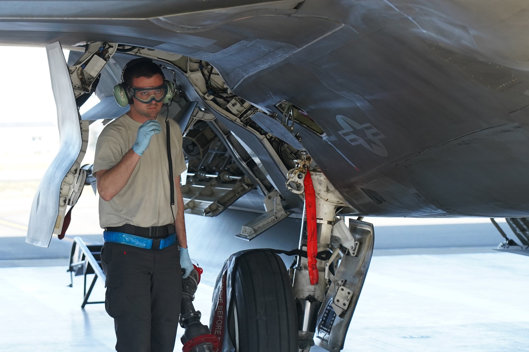 Air Force Staff Sgt. Jacob Boddy, a crew chief assigned to the 525th Fighter Squadron, holds a refueling hose after Airmen assigned to the 673d Logistics Readiness Squadron refueled an F-22 Raptor on Joint Base Elmendorf-Richardson, Alaska, Aug. 9, 2019.  Fuels specialists manage every aspect of the refueling every aircraft on the flight line and are responsible for operating the vehicles, equipment and storage facilities that are essential to refueling operations while ensuring compliance with all safety regulations while handling these volatile liquids.
