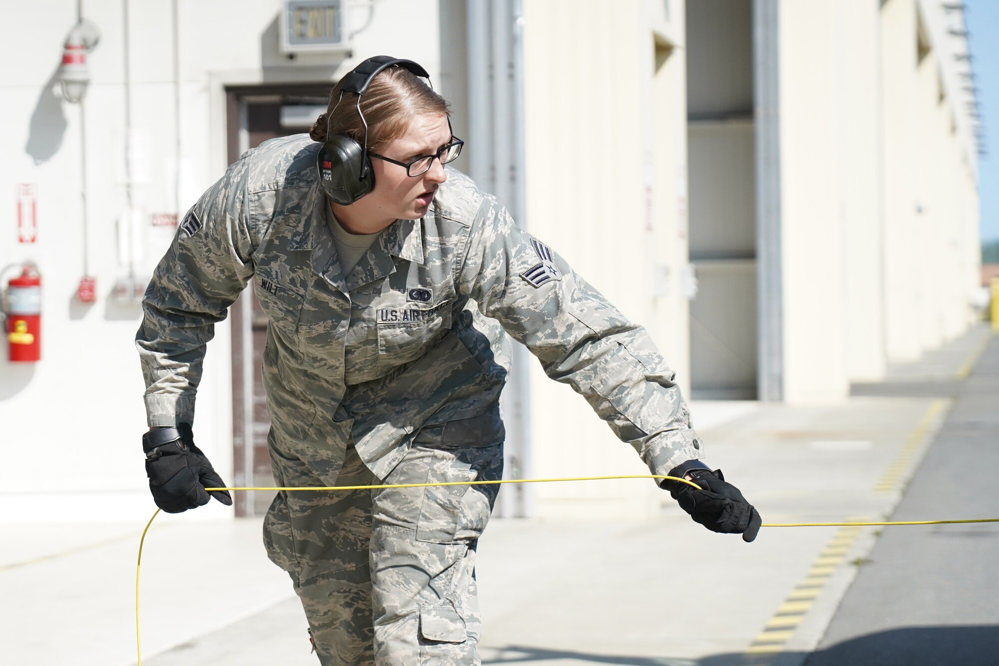 Senior Airman Jessica Wilt, a native of Washington Court House, Ohio, assigned to the 673d Logistics Readiness Squadron, uncoils a grounding cable before refueling an F-22 Raptor of the 525th Fighter Squadron (the Bulldogs) on Joint Base Elmendorf-Richardson, Alaska, Aug. 9, 2019.  Fuels specialists manage every aspect of the refueling every aircraft on the flight line and are responsible for operating the vehicles, equipment and storage facilities that are essential to refueling operations while ensuring compliance with all safety regulations while handling these volatile liquids.