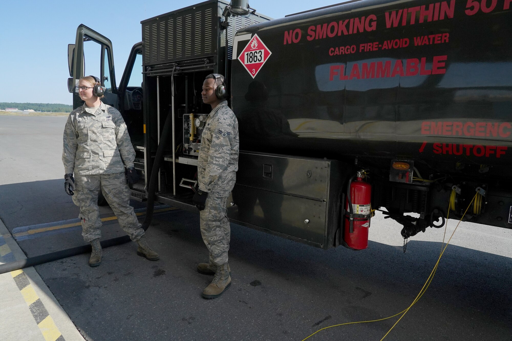 Senior Airman Jessica Wilt, left, and Airman 1st Class Anthony Moncrief, both assigned to the 673d Logistics Readiness Squadron, refuel an F-22 Raptor of the 525th Fighter Squadron (the Bulldogs) on Joint Base Elmendorf-Richardson, Alaska, Aug. 9, 2019.  Fuels specialists manage every aspect of the refueling every aircraft on the flight line and are responsible for operating the vehicles, equipment and storage facilities that are essential to refueling operations while ensuring compliance with all safety regulations while handling these volatile liquids.