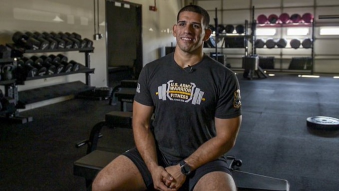 Soldier sitting in gym.